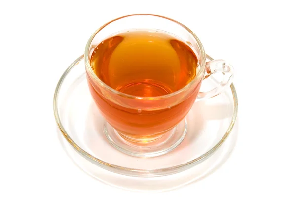 Xícara transparente de chá em um fundo branco — Fotografia de Stock