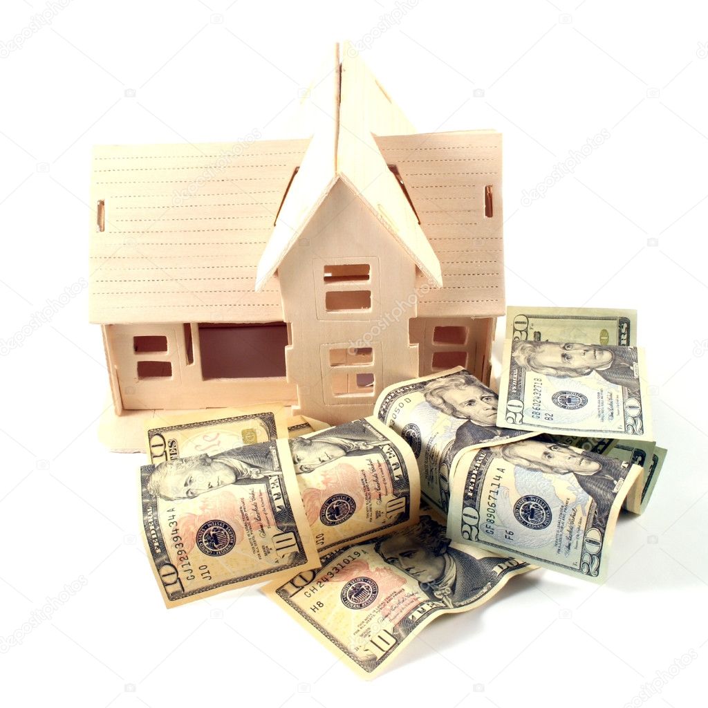 House and different dollar bills on a white background