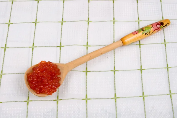 Wooden spoon with red caviar — Stock Photo, Image