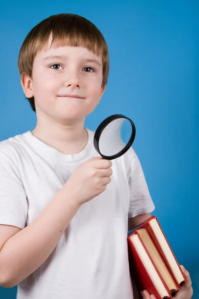 Boy with magnifying glass — Stock Photo, Image