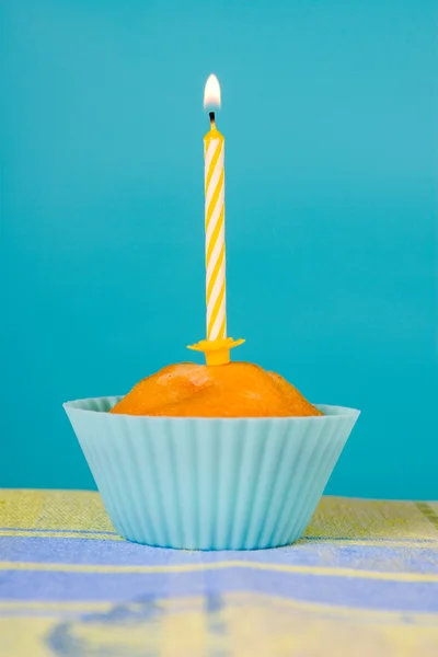 Festive cupcake with a candle — Stock Photo, Image