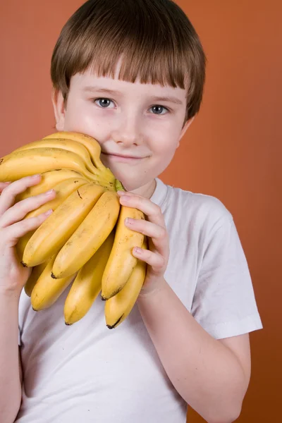Retrato niño sonriente con plátanos —  Fotos de Stock