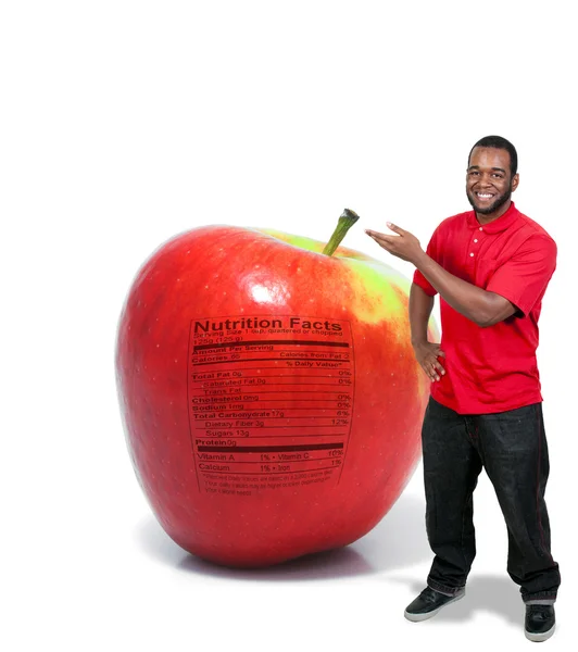 Man met een appel met voedingswaarde-etiket — Stockfoto