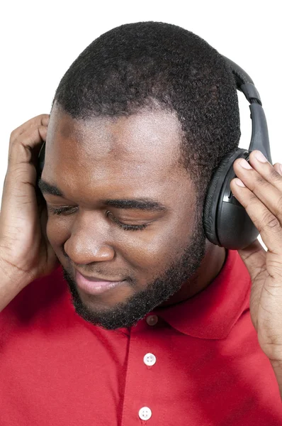Muž poslouchající sluchátka — Stock fotografie
