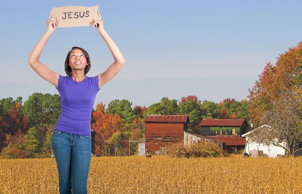 Kobieta trzyma znak Jezusa — Zdjęcie stockowe
