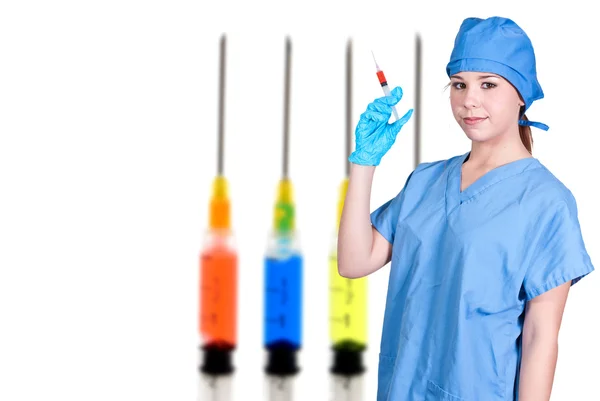 Žena lékař s injekční stříkačkou — Stock fotografie