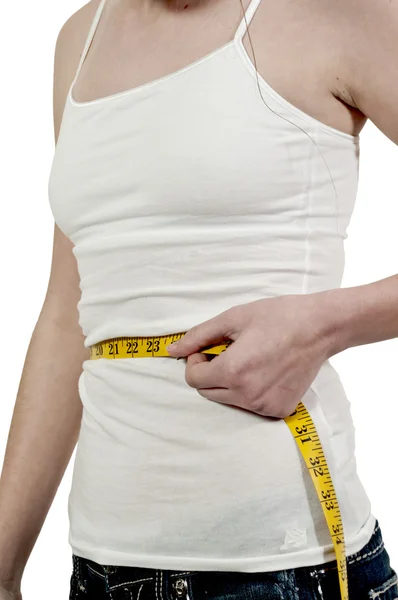 Vrouw meten van haar taille — Stockfoto