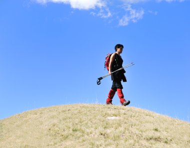 Sport walking on the ball hill woman trekking clipart