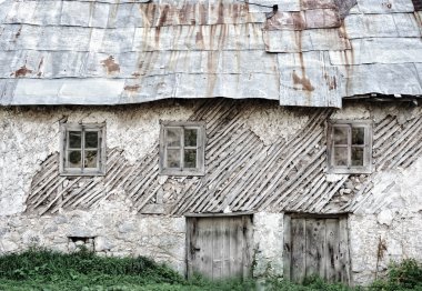 Old house in mountain village clipart