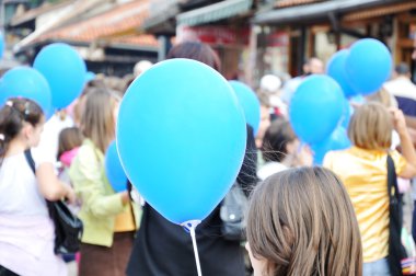 Group of teenage kids with baloons clipart