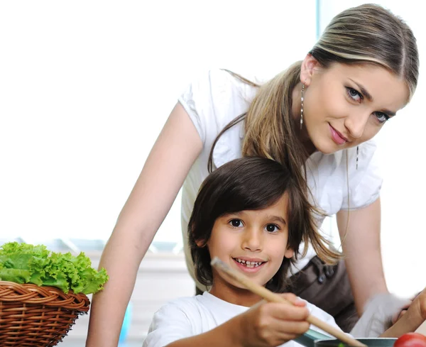 Mother and little son cooking in the kitchen — Stock Photo, Image