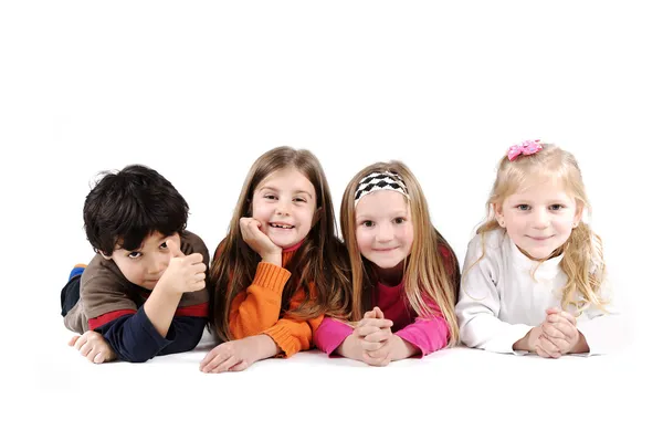 Children group family laying on floor ground isolated — Stock Photo, Image