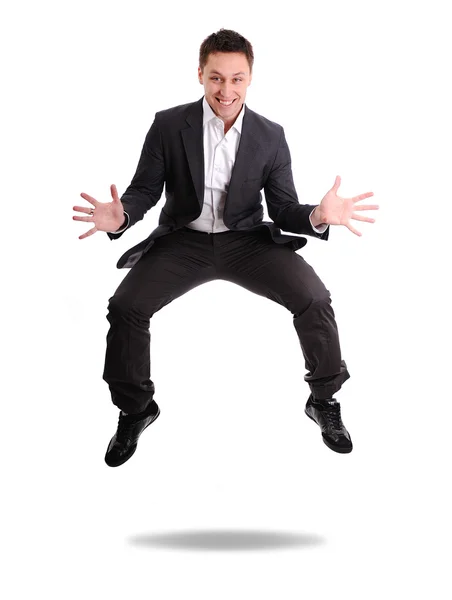 Full length of excited business man jumping — Stock Photo, Image