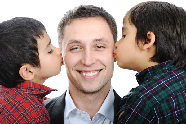 Two sons kissing father — Stock Photo, Image