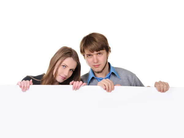 Teenage paar met witte plakkaat — Stockfoto