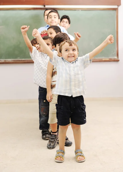 Children at school classroom — Stock Photo, Image