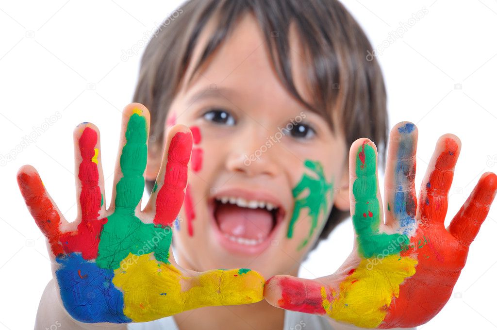 Happy kid with paints on hands