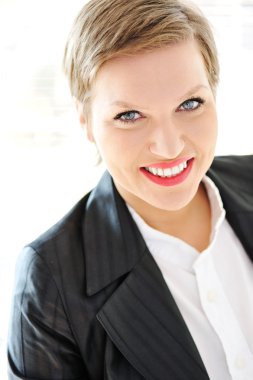 Portrait of positive young business woman smiling clipart