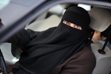 Muslim middle eastern female driver wearing veil clipart
