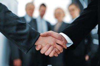 Handshake in front of business