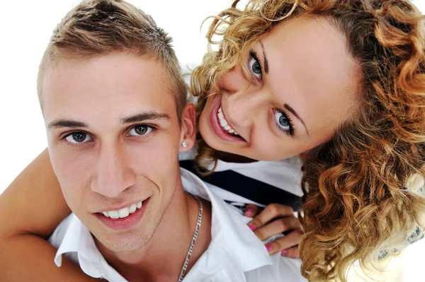 Portrait of a happy young handsome couple hugging isolated on white — Stock Photo, Image
