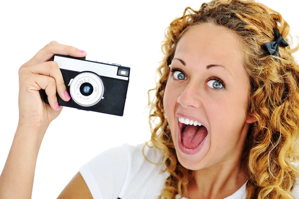 An excited teenage girl shouting holding a retro camera in hand — Stock Photo, Image