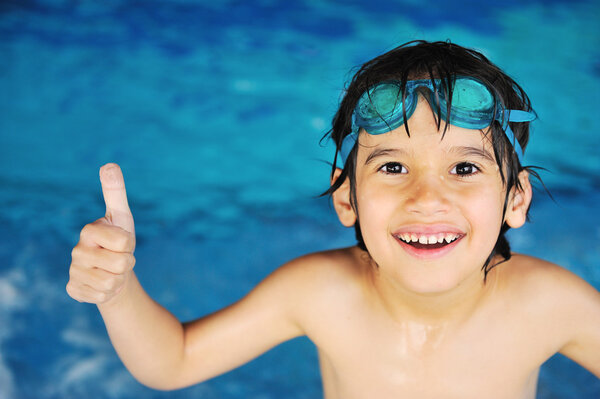 Little boy at swimming pool