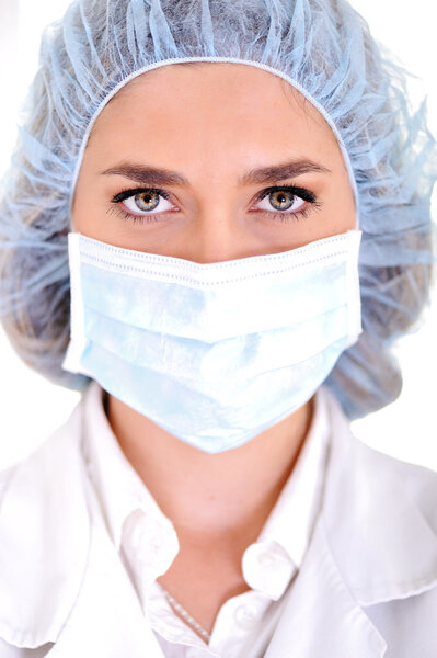 Female doctor wearing surgical cap and mask