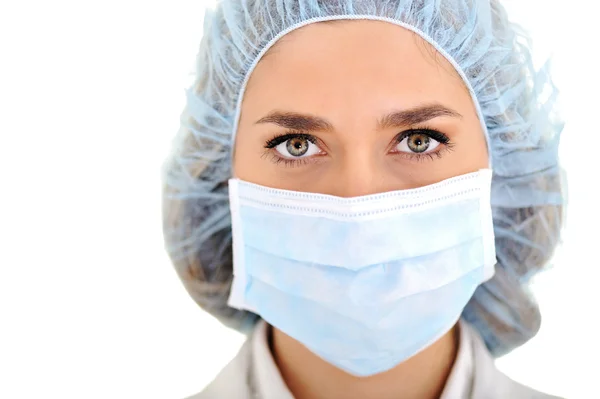 Női orvos-sebészeti sapkát és maszkot visel — Stock Fotó