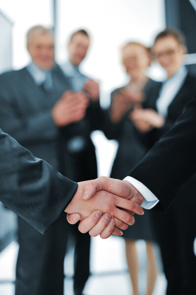 Succesful handshake with business aplauding
