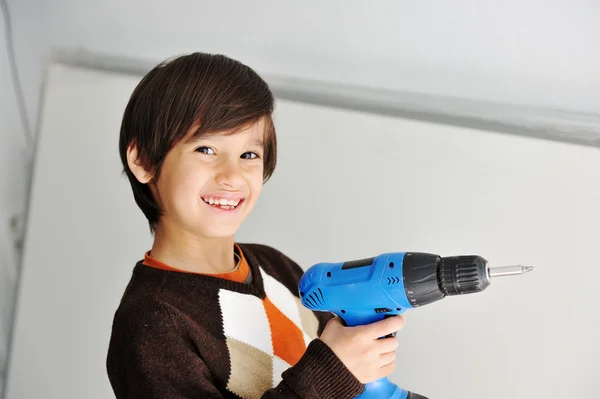 Kid with drill tool — Stock Photo, Image