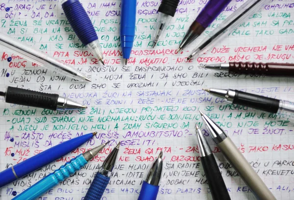 Pens and handwriting colorful notebook — Stok fotoğraf