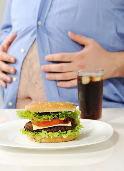 Fat stomach with burger and cola — Stock Photo, Image