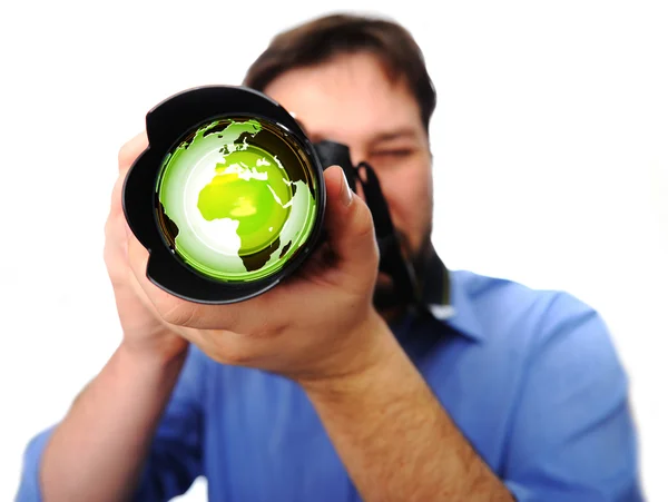 Man with camera earth green lens — Stock Photo, Image