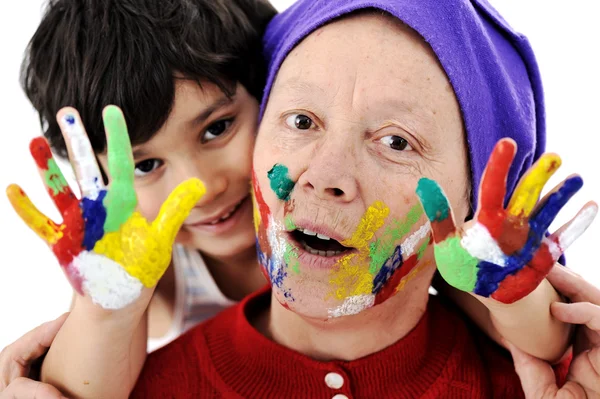 Pais com o filho brincando com cores bagunçadas Fotos De Bancos De Imagens
