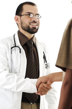 Young adult doctor shaking hand of patient and smiling clipart