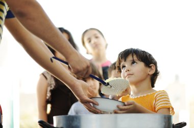 Hungry children in refugee camp, distribution of humanitarian food clipart