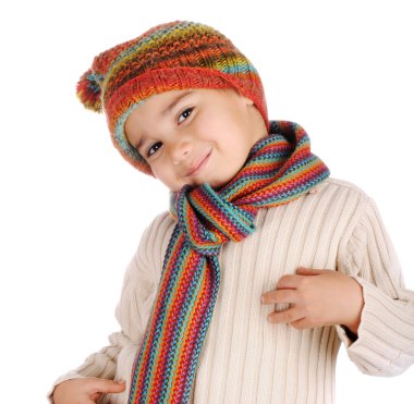 Cute kid with winter clothes isolated in studio