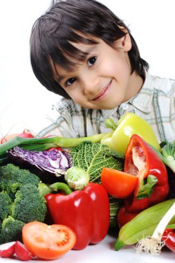 Child and fresh vegetables clipart