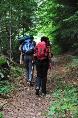 Walking up to mountain hills, sport adventures clipart