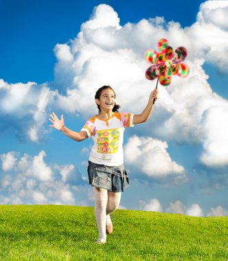 Fantastic scene of happy little girl running and playing carefreely clipart