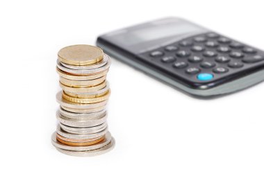 Coins in one place on calculator isolated clipart