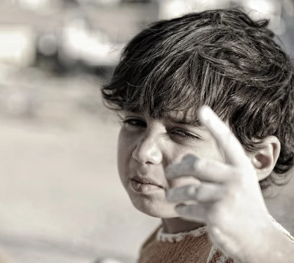 You are also responsible for this! Poor child with finger up. — Stock Photo, Image