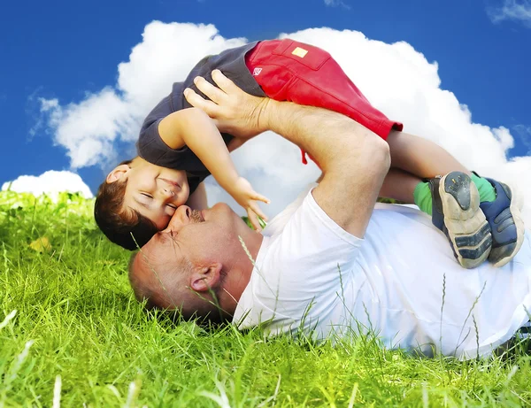 Grandfather and son on medow — Stock Photo, Image