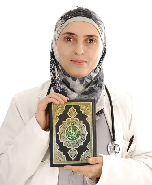 Doctor holding holy book Koran, solution for you, closeup — Stock Photo, Image