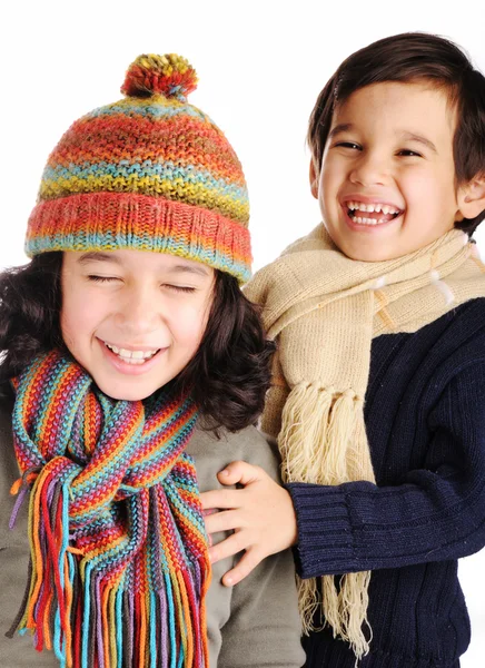 Cute children with winter clothes isolated in studio — Stock Photo, Image