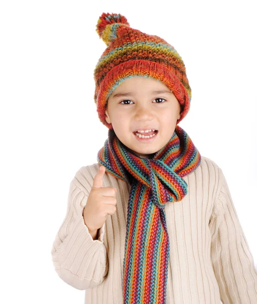 Χαριτωμένο παιδί με χειμωνιάτικα ρούχα απομονωμένη στο στούντιο — Φωτογραφία Αρχείου