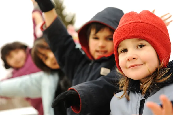 Happy group of children outdoor, winter clothes — Stock Photo, Image