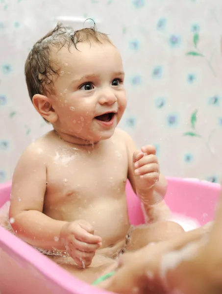 Adorable baby boy taking a bath with soap suds on hair — Stock Photo, Image