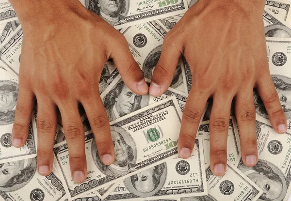 Фон доларів, людські руки — стокове фото